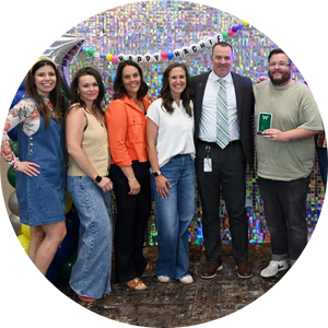  4 women and 2 men in front of groovy backdrop